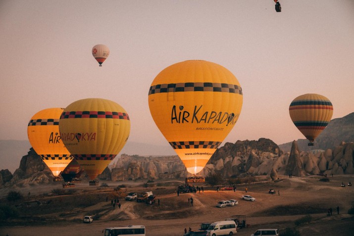 Discover the breathtaking views of Cappadocia with a hot air balloon ride, offering a unique perspective of the landscape at sunrise