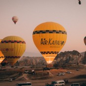 Discover the breathtaking views of Cappadocia with a hot air balloon ride, offering a unique perspective of the landscape at sunrise