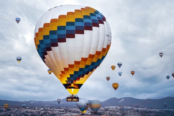 Enjoy a breathtaking balloon ride Göreme, witness the stunning sunrise over Cappadocia’s valleys, float above fairy chimneys, and capture moments