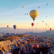 Take a magical ride with fairy chimneys hot air balloon in Cappadocia, soaring above breathtaking rock formations and enjoying the stunning sunrise